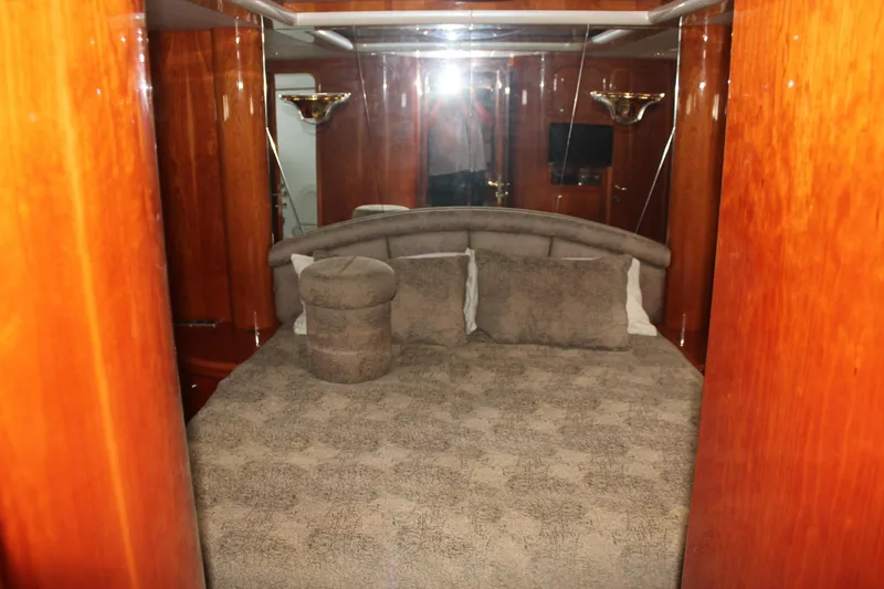 Slide: The Image of Luxurious bedroom interior of 1999 Horizon 70 Motor Yacht with plush bedding. - 46