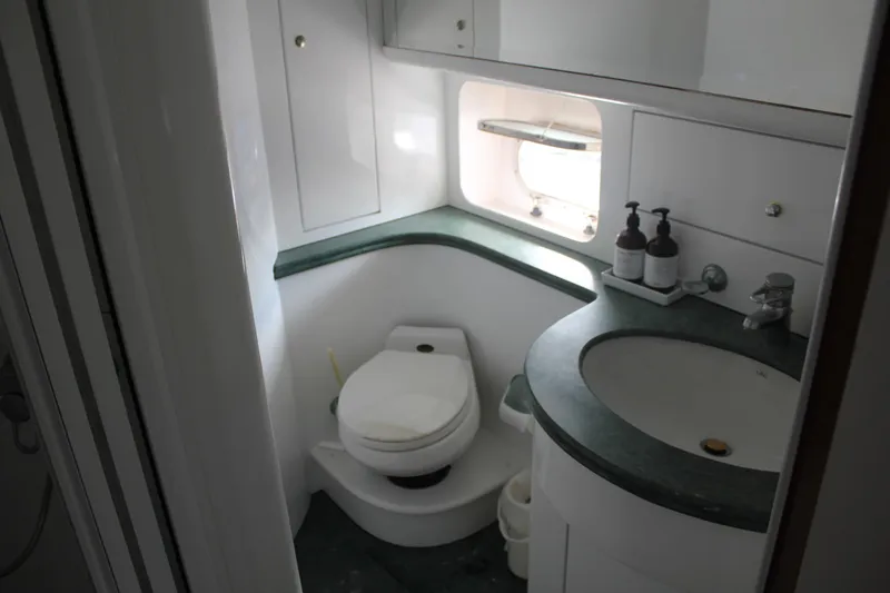 Slide: The Image of Bathroom interior of 1999 Horizon 70 Motor Yacht with sink and toilet. - 55