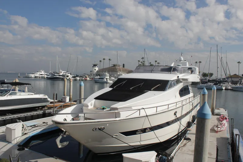 Slide: The Image of 1999 Horizon 70 Motor Yacht docked at marina under partly cloudy sky. - 69