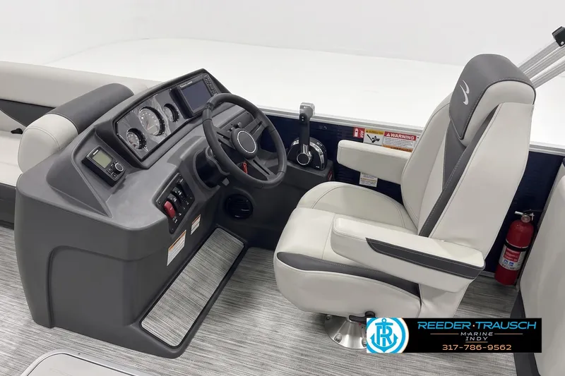 Slide: The Image of 2026 Bennington 22 SSR boat helm with steering wheel and captain's chair. - 3