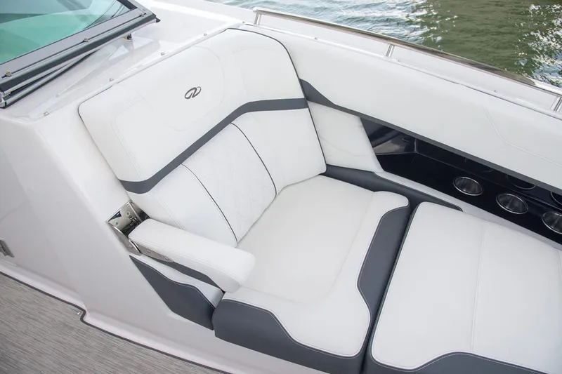 Slide: The Image of Manufacturer Provided Image: Luxurious seating on 2026 Regal 33 OBX boat with white and gray upholstery. - 6