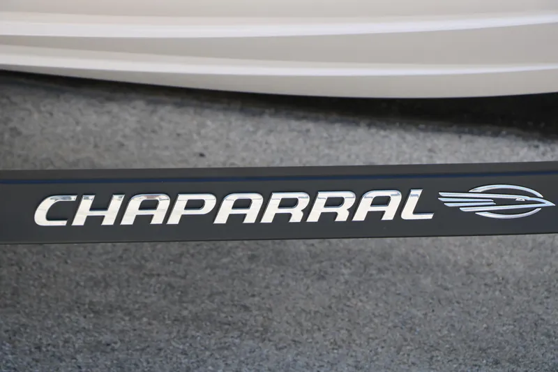 Slide: The Image of Chaparral 21 SSi Ski & Fish 2025 logo on a sleek black surface. - 16