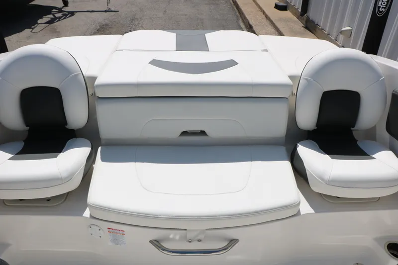 Slide: The Image of 2025 Chaparral 21 SSi Ski & Fish boat interior with white cushioned seating. - 35