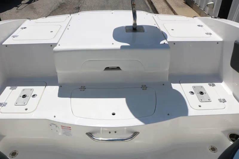 Slide: The Image of 2025 Chaparral 21 SSi Ski & Fish boat deck with storage compartments. - 39