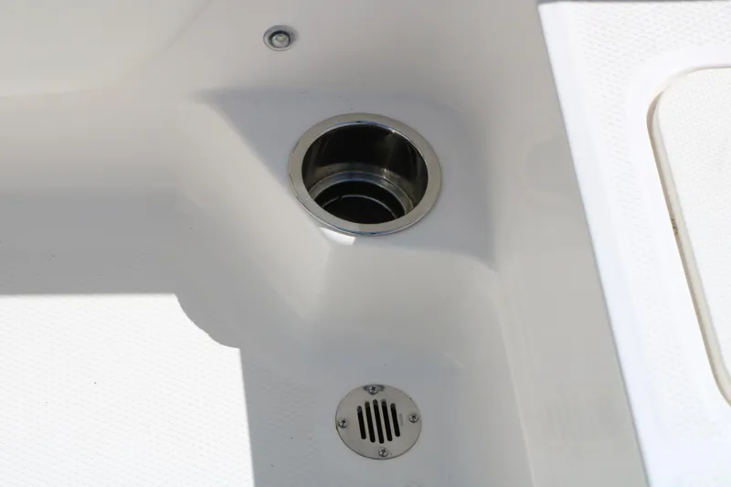 Slide: The Image of 2025 Chaparral 21 SSi Ski & Fish boat drain detail, showcasing sleek design. - 43