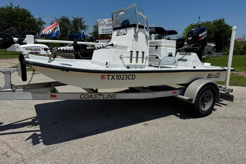The Image of 2014 Mowdy 13 Scooter boat on trailer with Minn Kota motor and Suzuki engine. - 0