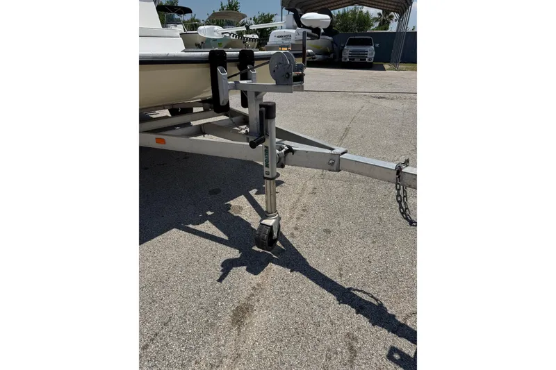 Slide: The Image of Trailer hitch of a 2014 Mowdy 13 Scooter boat on pavement. - 14