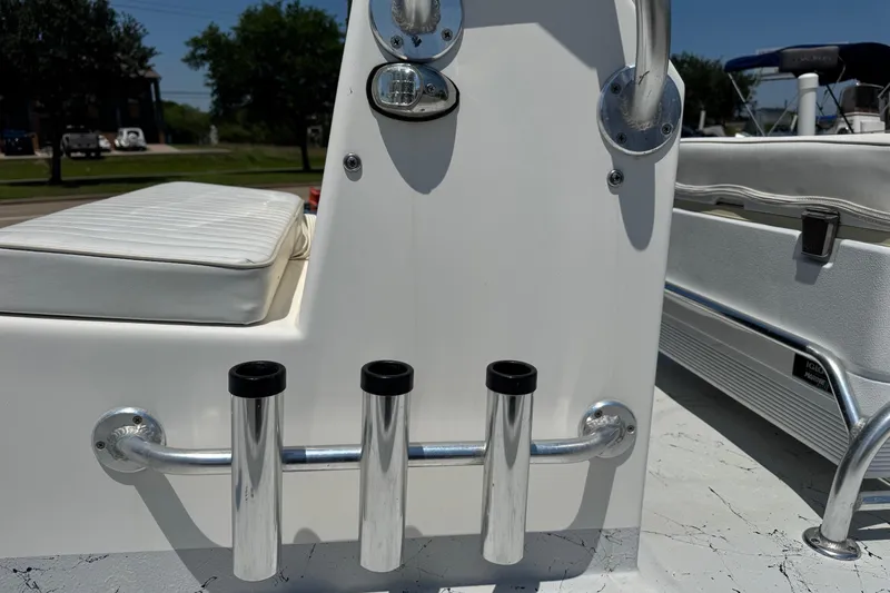 Slide: The Image of 2014 Mowdy 13 Scooter boat with rod holders and cushioned seating. - 4