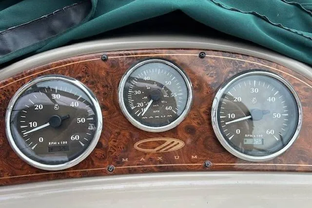 Slide: The Image of Dashboard of 2003 Maxum 2900 SCR boat with three analog gauges. - 4