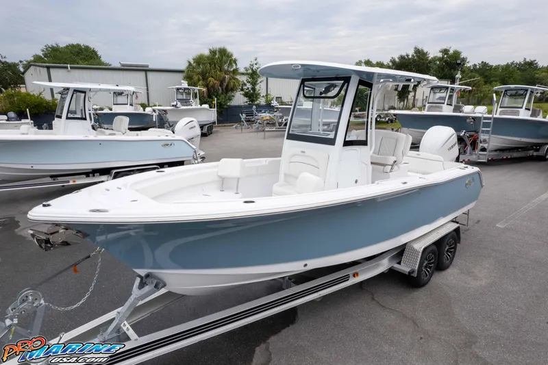 The Image of 2026 Sea Hunt Ultra 245 SE boat on trailer, displayed outdoors. - 1