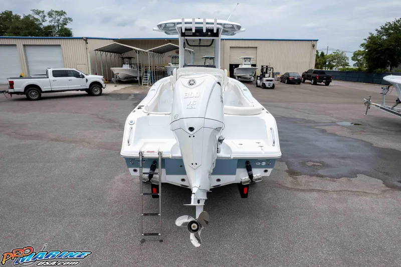Slide: The Image of 2026 Sea Hunt Ultra 245 SE boat with Yamaha 300 engine in a marina. - 10