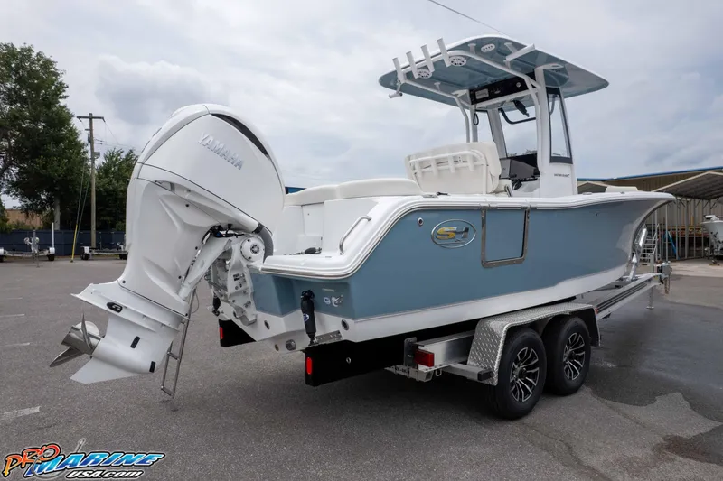 Slide: The Image of 2026 Sea Hunt Ultra 245 SE boat with Yamaha engine on trailer. - 12