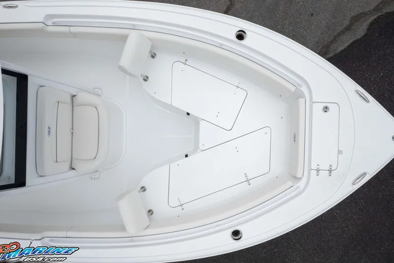 Slide: The Image of 2026 Sea Hunt Ultra 245 SE boat interior, featuring spacious seating and storage compartments. - 17