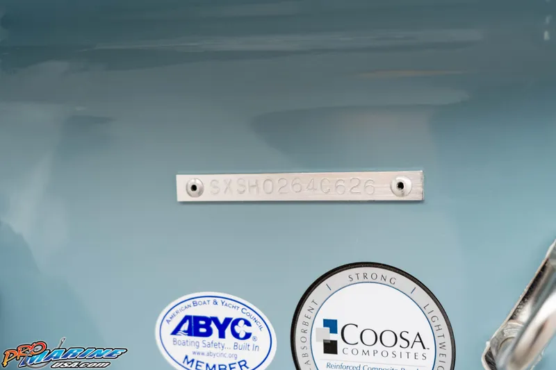 Slide: The Image of 2026 Sea Hunt Ultra 245 SE boat identification plate with ABYC and Coosa Composites stickers. - 20
