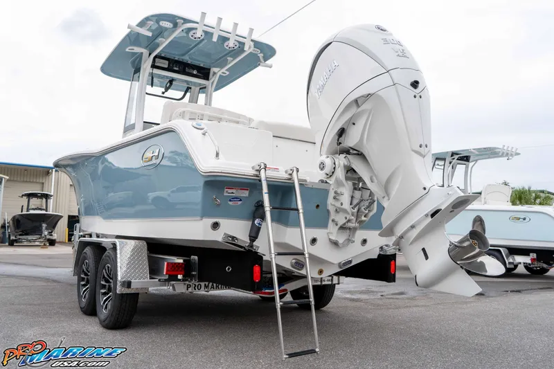 Slide: The Image of 2026 Sea Hunt Ultra 245 SE boat on trailer with Yamaha outboard motor. - 29