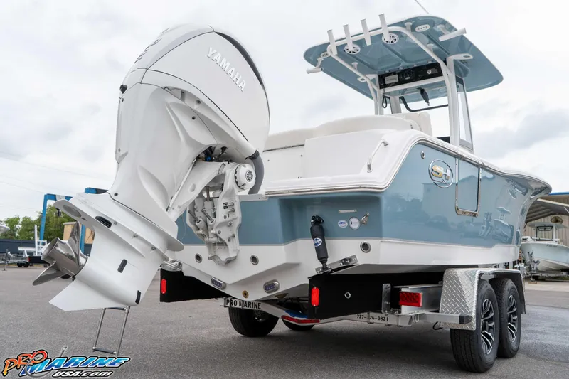 Slide: The Image of 2026 Sea Hunt Ultra 245 SE boat with Yamaha outboard engine on trailer. - 31