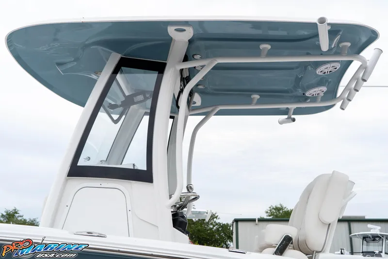 Slide: The Image of 2026 Sea Hunt Ultra 245 SE boat with T-top and seating, side view. - 35