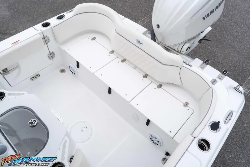 Slide: The Image of 2026 Sea Hunt Ultra 245 SE boat interior with Yamaha engine, featuring seating and storage. - 37