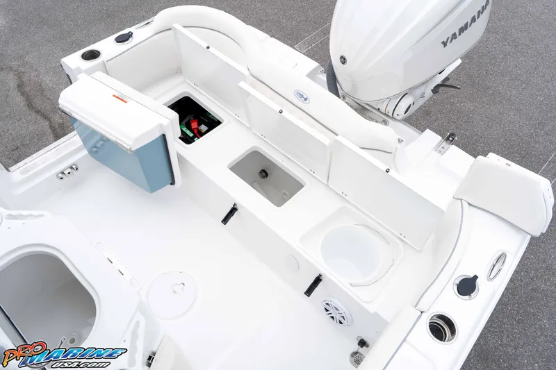 Slide: The Image of 2026 Sea Hunt Ultra 245 SE boat interior with Yamaha engine, featuring storage and seating. - 38