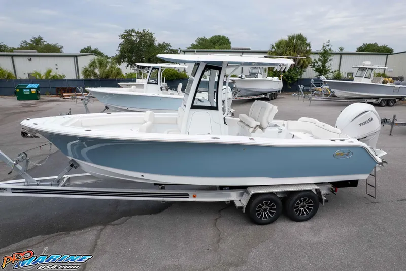 Slide: The Image of 2026 Sea Hunt Ultra 245 SE boat on trailer, featuring sleek design and Yamaha engine. - 4