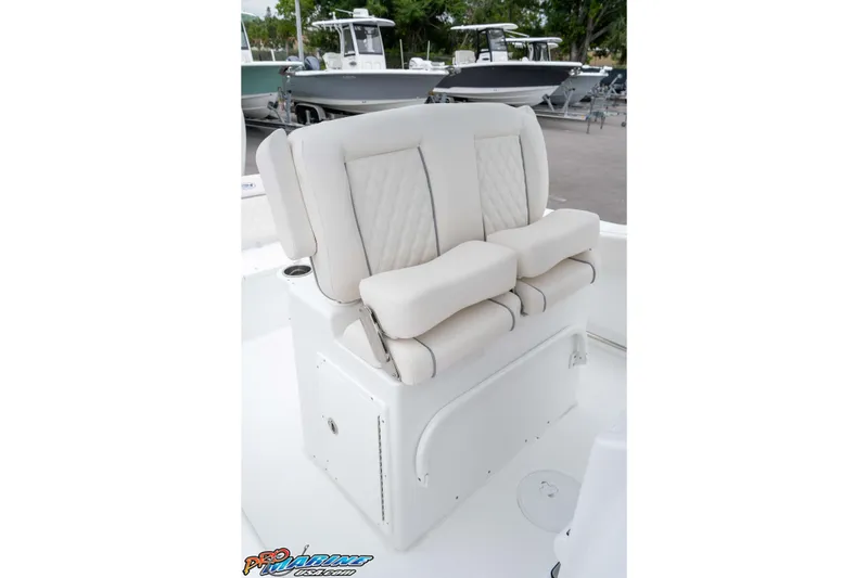 Slide: The Image of 2026 Sea Hunt Ultra 245 SE boat seating with cushioned backrest and armrests. - 44