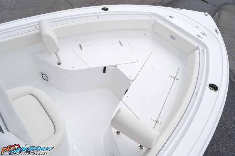 Slide: The Image of 2026 Sea Hunt Ultra 245 SE boat interior with white seating and storage compartments. - 46