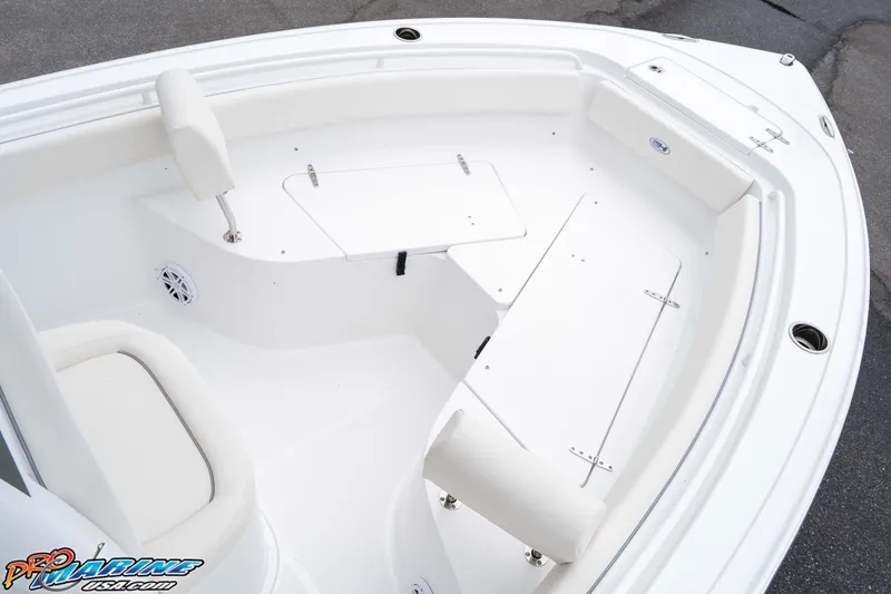 Slide: The Image of 2026 Sea Hunt Ultra 245 SE boat interior with seating and storage compartments. - 47