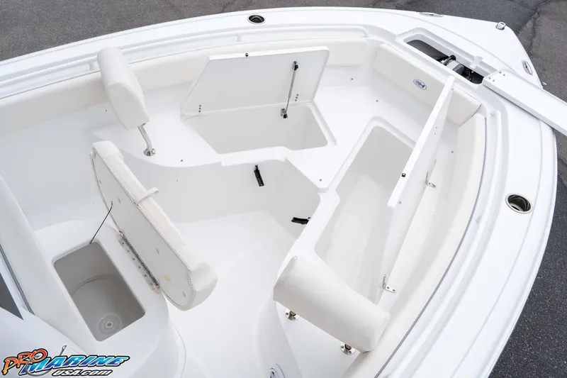 Slide: The Image of 2026 Sea Hunt Ultra 245 SE boat interior with seating and storage compartments. - 48