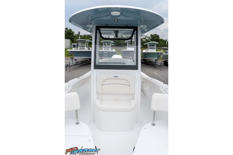 Slide: The Image of 2026 Sea Hunt Ultra 245 SE boat interior with seating and console view. - 49