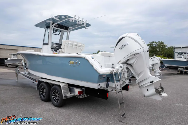 Slide: The Image of 2026 Sea Hunt Ultra 245 SE boat on trailer with Yamaha outboard motor. - 6