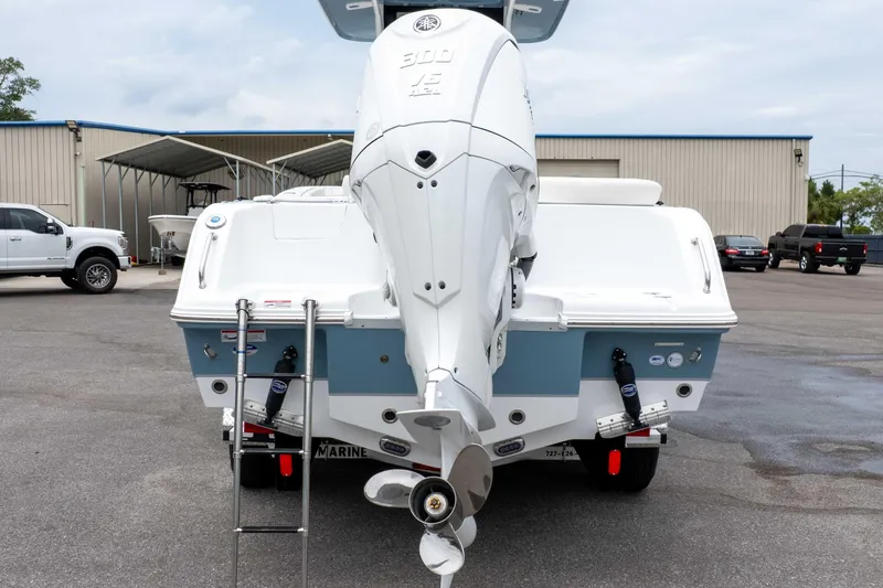 Slide: The Image of Rear view of 2026 Sea Hunt Ultra 245 SE boat with powerful outboard motor. - 9