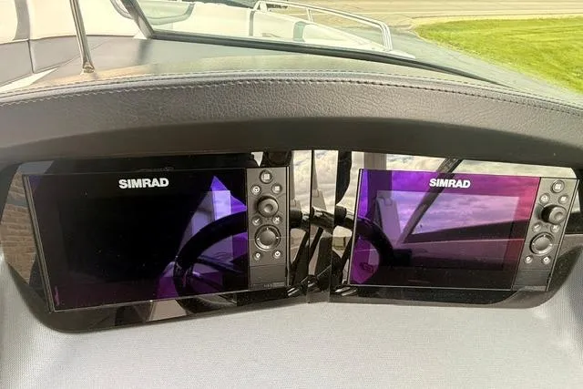 Slide: The Image of Simrad navigation displays on 2019 Chaparral 277 SSX boat dashboard. - 10
