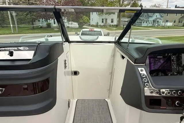 Slide: The Image of 2019 Chaparral 277 SSX boat interior with dashboard and windshield view. - 15