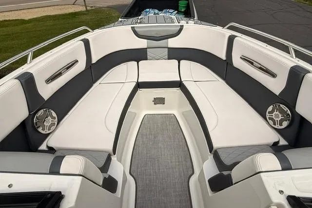 Slide: The Image of 2019 Chaparral 277 SSX boat interior with white and gray seating. - 19