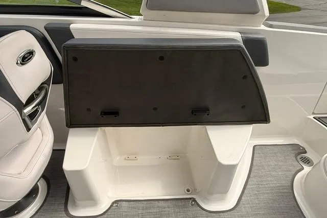 Slide: The Image of 2019 Chaparral 277 SSX boat interior storage compartment with seating and upholstery. - 26