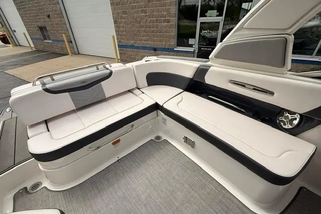 Slide: The Image of 2019 Chaparral 277 SSX boat interior with white and black seating. - 27