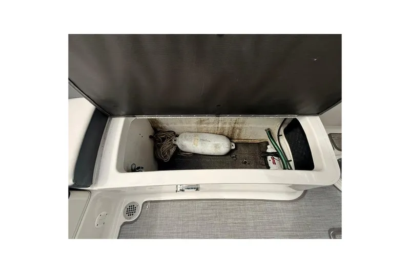 Slide: The Image of Storage compartment of 2019 Chaparral 277 SSX boat with equipment and accessories. - 29