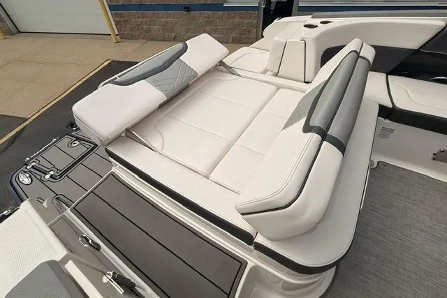 Slide: The Image of 2019 Chaparral 277 SSX boat with luxurious white seating and sleek design. - 32