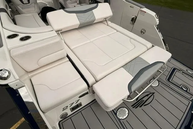 Slide: The Image of 2019 Chaparral 277 SSX boat interior with white seating and deck details. - 33