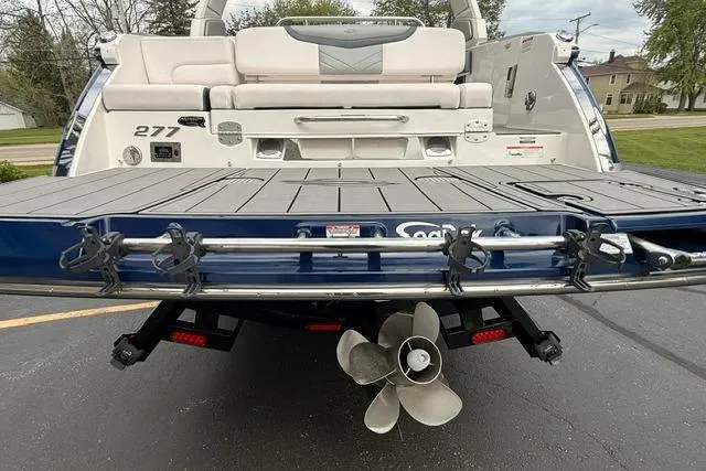 Slide: The Image of Rear view of a 2019 Chaparral 277 SSX boat with swim platform and propeller. - 37