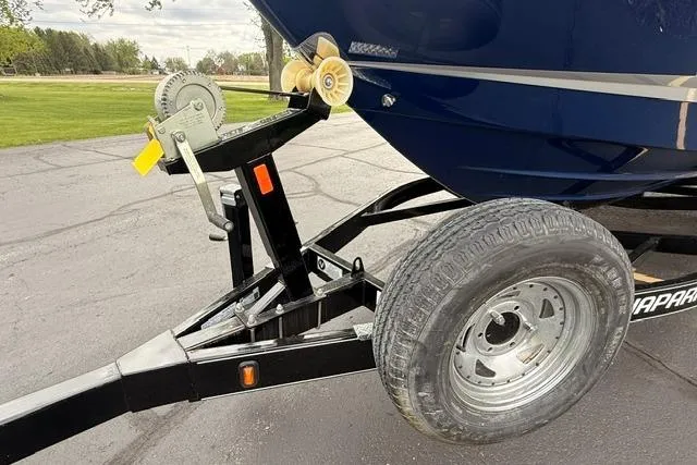 Slide: The Image of Trailer hitch and wheel of 2019 Chaparral 277 SSX boat on pavement. - 43