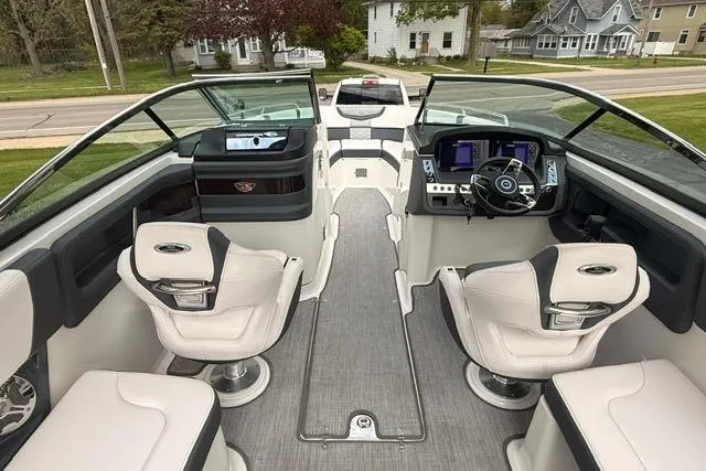 Slide: The Image of 2019 Chaparral 277 SSX boat interior with modern dashboard and seating. - 5