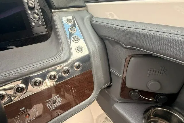 Slide: The Image of 2019 Chaparral 277 SSX boat dashboard with control panel and Polk audio system. - 9