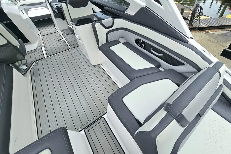 Slide: The Image of 2023 Yamaha Boats 275SDX interior with sleek seating and modern design. - 12