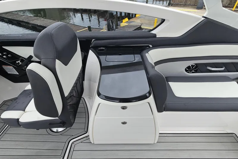 Slide: The Image of 2023 Yamaha Boats 275SDX interior with sleek seating and modern design. - 15