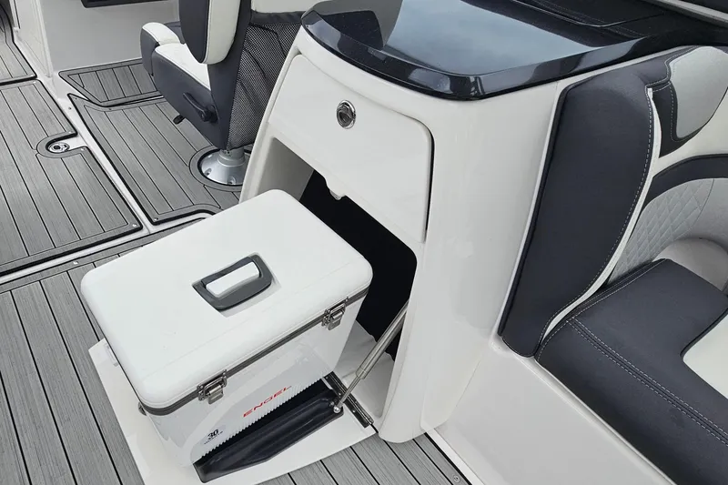 Slide: The Image of 2023 Yamaha Boats 275SDX interior with seating and storage compartment. - 16