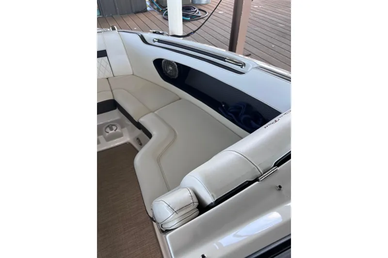 Slide: The Image of Luxurious seating on 2018 Sea Ray SLX 250 boat, featuring elegant white upholstery. - 10
