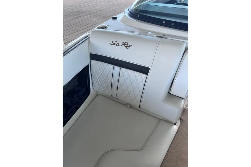 Slide: The Image of 2018 Sea Ray SLX 250 boat interior with luxurious white leather seating. - 11