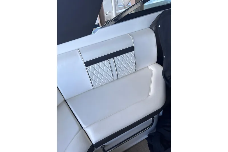 Slide: The Image of Luxurious interior seating of 2018 Sea Ray SLX 250 boat with quilted design. - 17