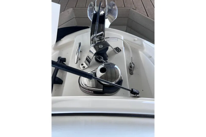 Slide: The Image of 2018 Sea Ray SLX 250 boat anchor system with polished metal components. - 22
